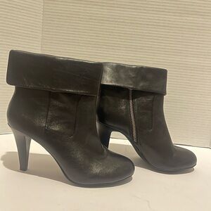 Michael Kors black zip boots.